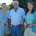 Katie Sozansky, from left, Gerald Klingaman and Deborah Coley visit at Red, White and Blooms.

