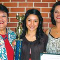 Award recipient Deysy Vargas, center is joined by presenter Carolyn Ryan, left, and her godmother Sa...