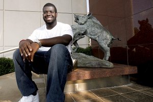 Arkansas freshman Jeremiah Jackson sits outside the Broyles Center at Reynolds Razorback Stadium in Fayetteville.