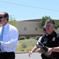 Albuquerque Mayor Richard Berry, left, and Police Chief Ray Schultz, right, leave a news conference ...