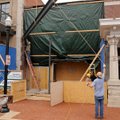 A Northwest Arkansas Steel Co. crew moves a steel I-beam into place Monday where it will support a n...