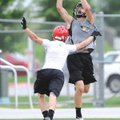 Bentonville’s Alex Horton hauls in a touchdown pass during Monday’s action against Farmington in the...