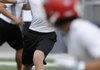 Farmington’s Trey Spencer throws to a receiver during Monday’s action in the Northwest Arkansas 7-on-7 Passing League in Bentonville’s Tiger Stadium.