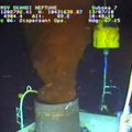 In a photo made from video released by BP PLC, oil emerges from a cap placed on the broken wellhead ...