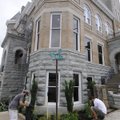 Chris Harty, left, and Nathan Streett landscape a corner of the old Washington County Courthouse on ...