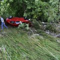Mark Myers, an employee of Greenland Wreckers, prepares on Tuesday to remove a Chevrolet Cobalt from...