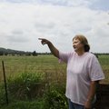 Lisa Martindale points to the proposed U.S. 412 northern bypass route Tuesday that would cross south...