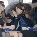 Emily McGarrah (from left), widow of Spc. Clayton D. McGarrah; his mother, Michele McGarrah; and fat...