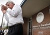 Arkansas Gov. Mike Beebe applauds as he walks from a speakers' platform at the William A. Gwatney Democratic Headquarters in Little Rock on Friday. The building was named in honor of Gwatney, who in 2008 was shot and killed while serving as state party chairman in the building. 