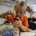 HAIR-RAISING CREATION - Lance Yarbrough, 6, works on his creation Thursday during Camp Invention at ...