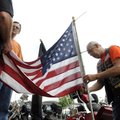 READY TO FLY - Steve Hafliger, right, road captain with the Northwest Arkansas Harley Owners Group, ...