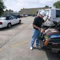 Leon Richardson looks through the trunk of his small car Thursday after parking in an unmarked spot ...