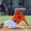 Rogers Heritage’s Jeremy Rook slides into home during Friday’s game against Fayetteville in the Ozar...