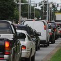 WAITING FOR CHANGE - Traffic backs up Friday at the intersection of Southeast Moberly Lane and South...