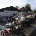 PROFIT FOR PAWS - Shoppers and volunteers move among the items for sale Friday during the Bargain Ya...