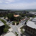 Shoppers and vendors circle the Fayetteville downtown square on a recent afternoon during the Fayett...