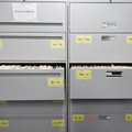 File cabinets of warrants sit in the dispatch office at the Springdale Police Department. The depart...