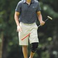 Anthony Delao smiles after sinking a long putt for eagle on No. 4 during the club championship tourn...