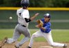 Rogers High’s Jason Selderidge catches Springdale Har-Ber’s Jeff Kadri attempting to steal second base Saturday during their game in the Northwest Arkansas Wood Bat League Conference Tournament at Veterans Park in Rogers. Kadri was out on the play.