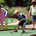 Kiersten Colston, 4, left, and Leela Soukup, 5, right, watch as Aiden Portlock, 5, makes his final p...