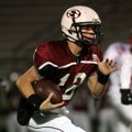 Springdale High quarterback Joseph Calcagni runs for yardage against Fort Smith Northside on Oct. 16...