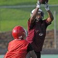 Springdale High’s Kempys Robinson hauls in a pass over a Fort Smith Northside defender Monday during...
