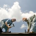 Allserto Luna, left, and Jose Luis Luna endure the heat Monday while laying down tar paper before in...
