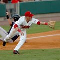 Arkansas third baseman Ryan Mount makes an attempt at a diving catch but misses the throw from left ...