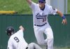 First baseman Gordon Miller records an out for Fayetteville Lindsey & Associates during Monday’s game against Mountain Home in the American Legion Zone 1 championship in Fayetteville.