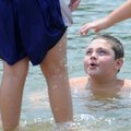 Dylan Junior, 11, of Rogers swims Wednesday in Beaver Lake in Monte Ne. Dylan was riding bikes with ...