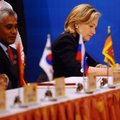 U.S. Secretary of State Hillary Rodham Clinton, right, signs the Treaty of Amity and Cooperation alo...