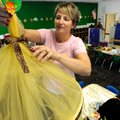 JUNGLE NOOK - Sue McCarthy hangs a reading nook canopy she created for her first-grade students Thur...