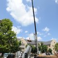 TALL TASK - Workers with Mountain Mechanical Contractors in Fayetteville load ductwork removed Thurs...