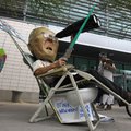 Dressed up to depict Maricopa County Sheriff Joe Arpaio, Jorge Mendez joins dozens to protest the SB...