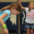 HOOP’IN IT UP - Gracie Carr, 7, of Rogers, practices tricks with a hula hoop Thursday at the Rogers ...