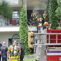TOTAL LOSS - Fayetteville firefighters work to remove smoke Friday from a unit at College Station Ap...