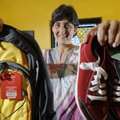 Mary Jane Silva holds a backpack and a pair of athletic shoes. They are some of the items that will ...