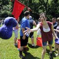 Dana Mallory, 17, from Oakland Heights Baptist Church of Longview, Texas, tosses a wet sponge to one...