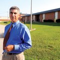 Dr. Larry Ben, new superintendent of Decatur schools, walks the grounds of the high school on July 1...