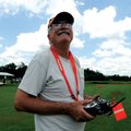 Bob Wideman, with Ozark Flyers Remote Control Model Airplane Club, guides his plane through the air ...