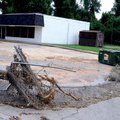 A fence that once bordered the Head Start building in Springdale lays in the parking lot July 14 aft...