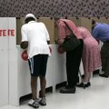 FILE — Early voters fill out their ballots in Oklahoma City, Monday, July 26, 2010. Oklahoma's prima...