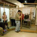 Jennifer Sweet, far right, and John Burroughs, center, remove a display panel Monday while dismantli...