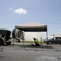 Travis Hart, with BLD Services of Kenner, La., works on the sewer line under Old Missouri Road in Sp...