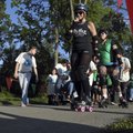 Participants in the 2010 Roll ‘n’ Walk 5k ability walk start the event Tuesday along the Scull Creek...