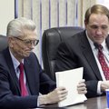 Fremont Mayor Skip Edwards, left, collects his papers following a city council meeting with city adm...