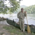 Jack Butt of Fayetteville stands along the White River at Buffalo City in June after hiking and padd...