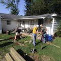 RAMP CONSTRUCTION - Wayne Thomas, left, of Siloam Springs, Charles Richardson of Fayetteville and Ra...