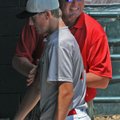  Roger Clemens, right, works to loosen up the arm of a Houston Heat player between innings Thursday ...