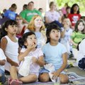 SUMMER END CELEBRATION - Kailen Osorio, middle right, and Bellyni Capacho, middle left, listen to a ...